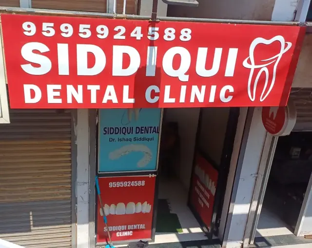 Red Siddiqui Dental Clinic signboard above the clinic in Shahbazar